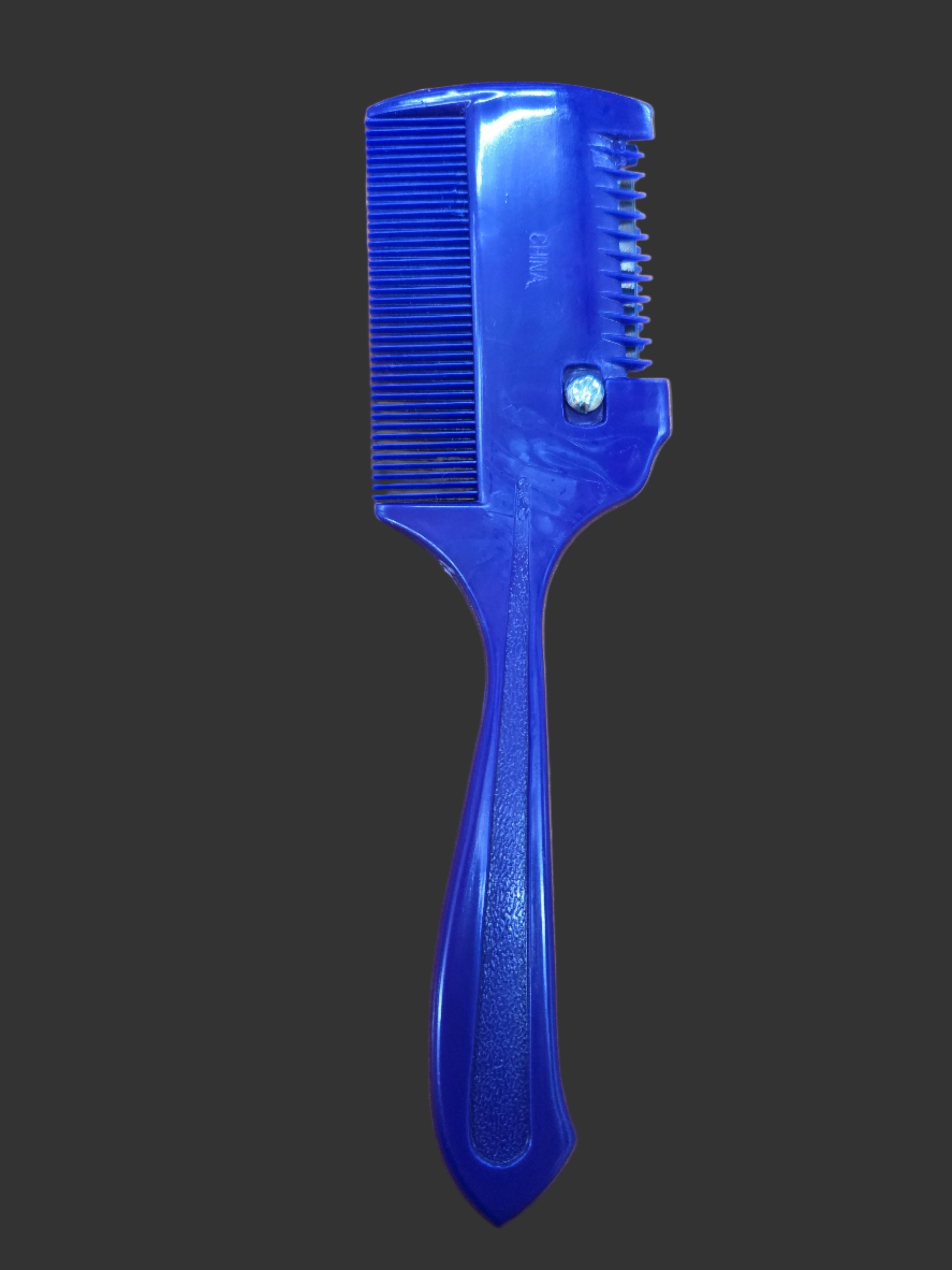 Blue grooming tool on a wooden surface with a ruler for scale.